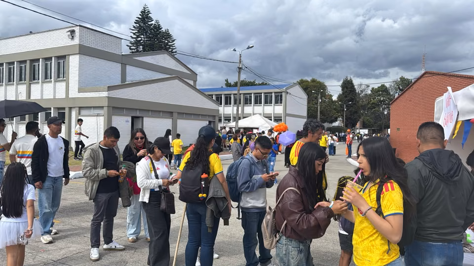 Attendees, several wearing Colombia national team shirts, at the Colombian National Police Family Day